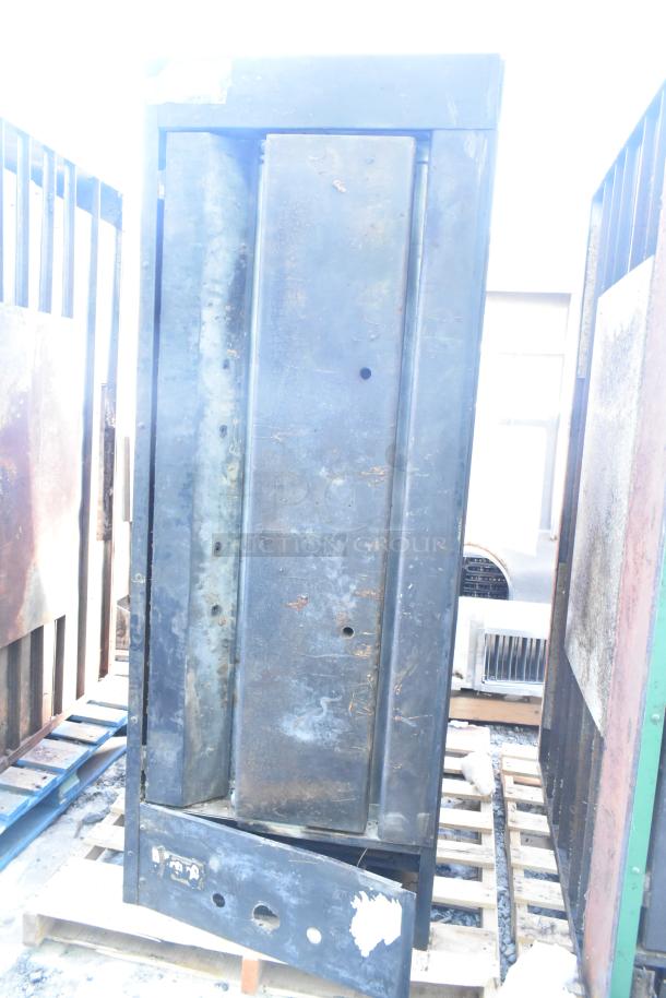 Montague 24P-2 commercial natural gas single deck pizza oven, visibly worn, on pallet. Parts and structure apparent.