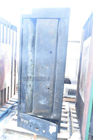 Montague 24P-2 commercial natural gas single deck pizza oven, visibly worn, on pallet. Parts and structure apparent.