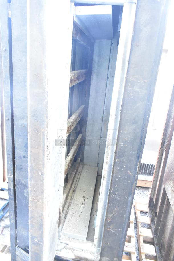 Montague 24P-2 commercial pizza oven, natural gas powered, single deck, visible signs of wear, suitable for high-volume use.