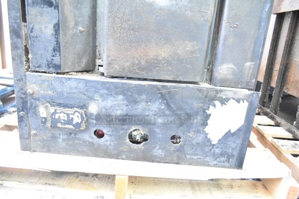 Montague 24P-2 commercial gas pizza oven, single deck. Well-used condition with visible rust and wear, Montague label intact.