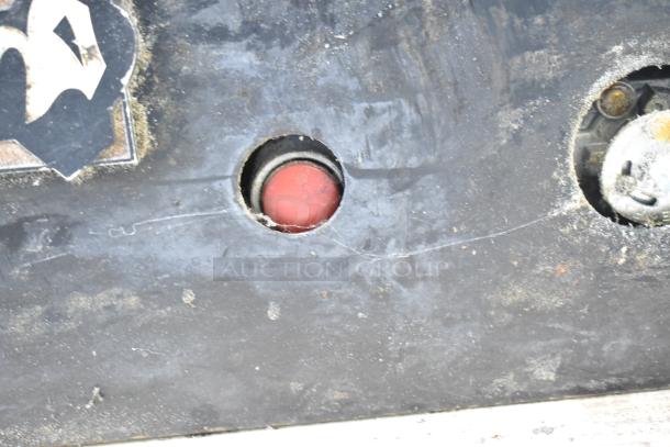 Montague 24P-2 commercial pizza oven exterior, showing natural gas controls, in used condition with visible wear.