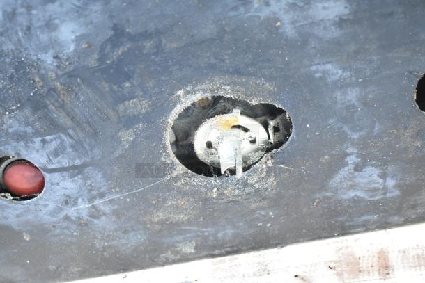 Montague 24P-2 pizza oven control panel detail, showing natural gas components with signs of wear and use.