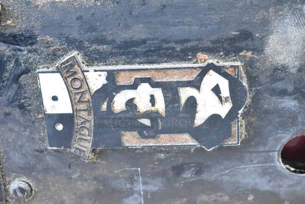 Montague 24P-2 single deck pizza oven, natural gas powered, showing logo and visible wear on exterior panel.