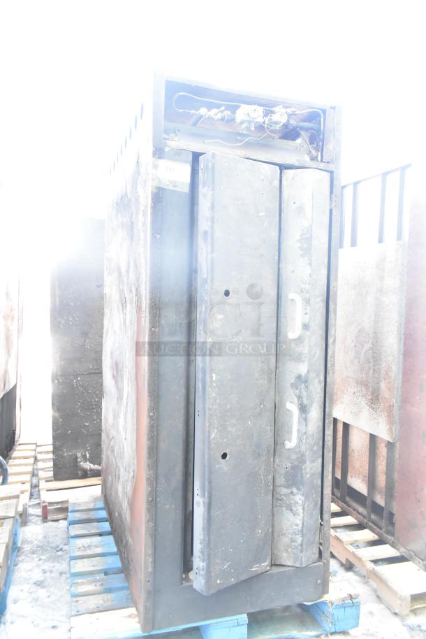 Montague commercial natural gas single deck pizza oven, used condition, with visible rust and metal wear, placed on pallets.