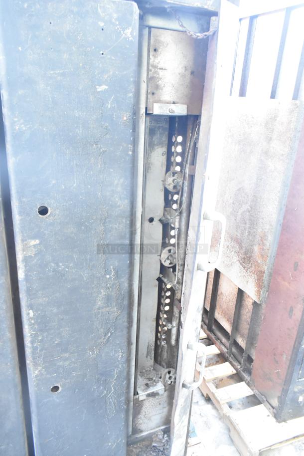 Montague Commercial Natural Gas Single Deck Pizza Oven in used condition, showing interior mechanics and exterior wear.