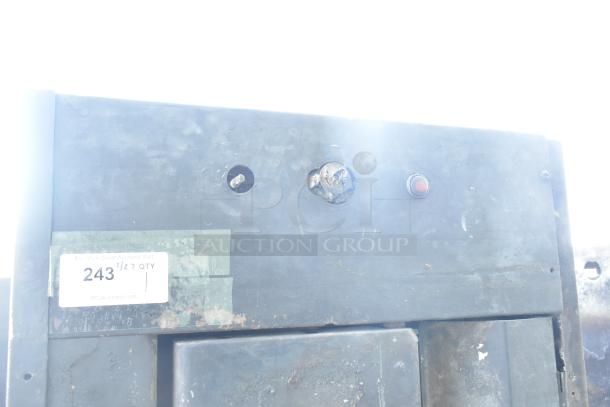 Montague Commercial Natural Gas Single Deck Pizza Oven, features knobs, numbered label "243", worn condition.