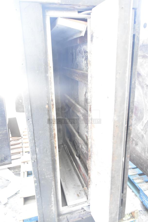 Montague Commercial Natural Gas Single Deck Pizza Oven in used condition with visible wear and rust inside.