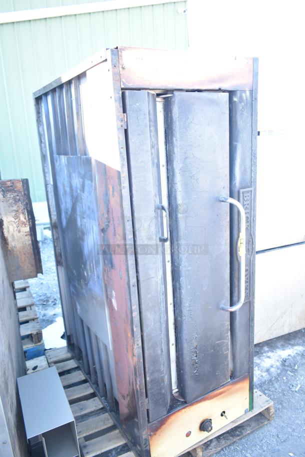 Montague 24P-2 commercial single deck pizza oven, natural gas powered, shows visible signs of use, sturdy metal construction.