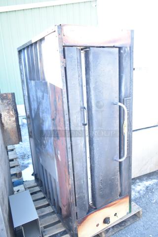 Montague 24P-2 commercial single deck pizza oven, natural gas powered, shows visible signs of use, sturdy metal construction.