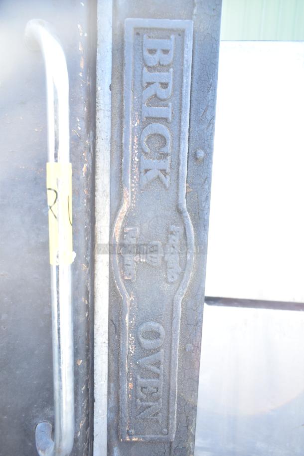 Montague 24P-2 commercial pizza oven, natural gas, single deck, iron door panel with "Brick Oven" engraving.