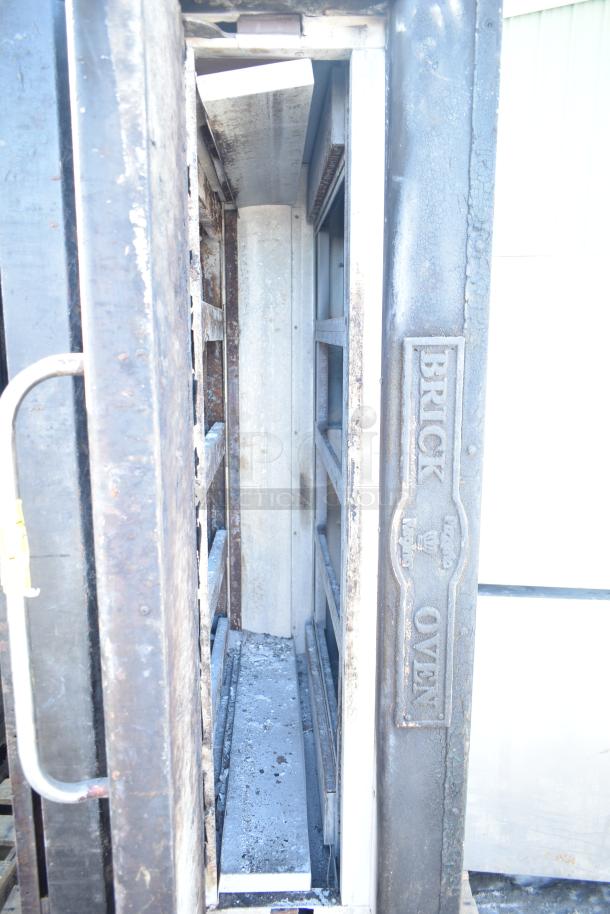 Montague 24P-2 commercial natural gas single deck pizza oven, brick design, visible wear, industrial use.