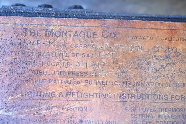 Montague 24P-2 Commercial Gas Pizza Oven label, showing model and serial number. Marks of wear and visible rust.
