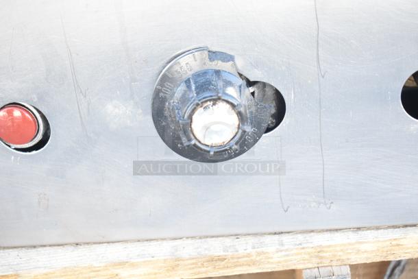 Montague Commercial Natural Gas Pizza Oven control panel, featuring a broken temperature knob and visible markings.