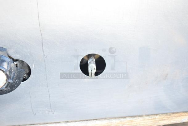 Montague Commercial Natural Gas Pizza Oven control panel, featuring a metal exterior with visible gas valve and adjustment knob.