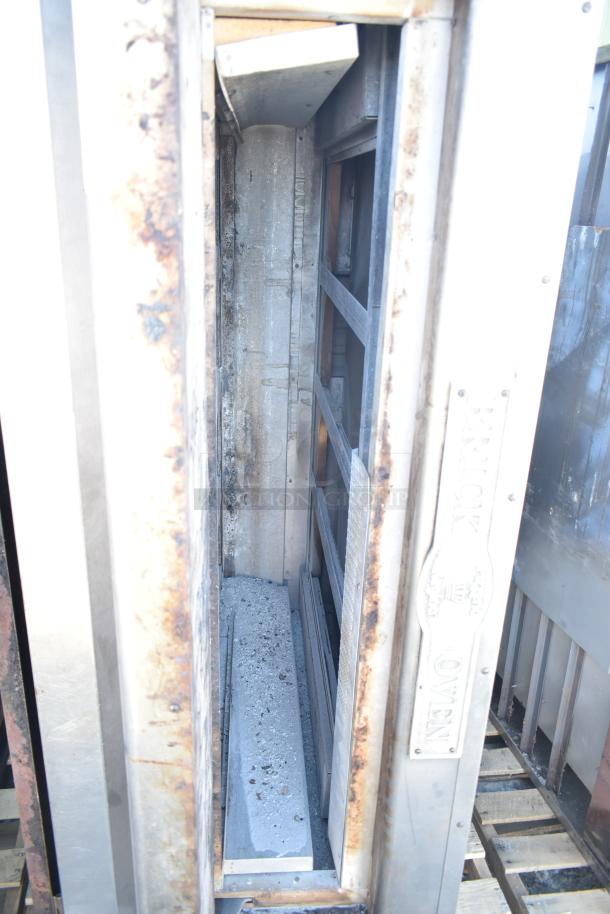 Montague commercial natural gas single deck pizza oven, stainless steel, visible wear, includes lower brick insert.