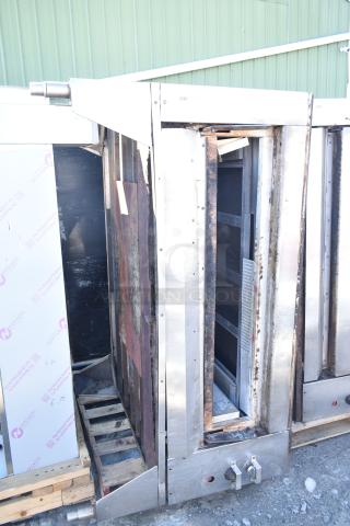 Montague Commercial Natural Gas Single Deck Pizza Oven with legs, visible wear, sturdy stainless steel construction.