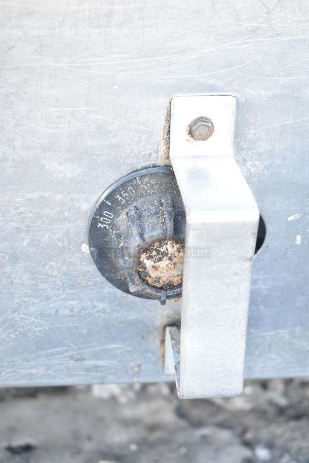 Rusted dial on Montague Commercial Natural Gas Single Deck Pizza Oven. Adjusts temperature from 300 to 350 degrees.