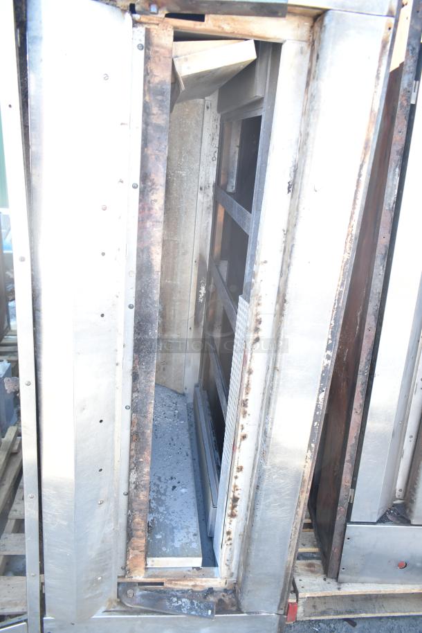 Montague commercial natural gas pizza oven, single deck with legs, interior view, shows signs of wear, stainless steel finish.