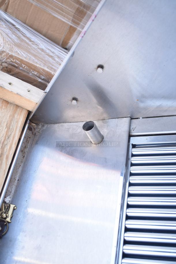 BRAND NEW CaptiveAire 6024 ND-2WI commercial grease hood, visible filters and small dent, with lights, stainless steel construction.