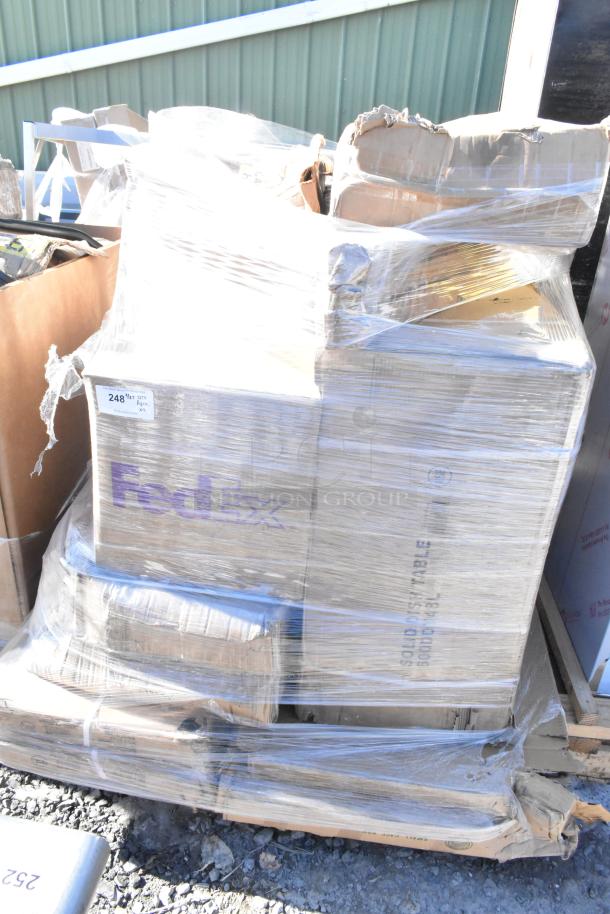 Pallet of nine new scratch and dent items including ingredient bin and dish table, wrapped in plastic, some boxes marked "FedEx".