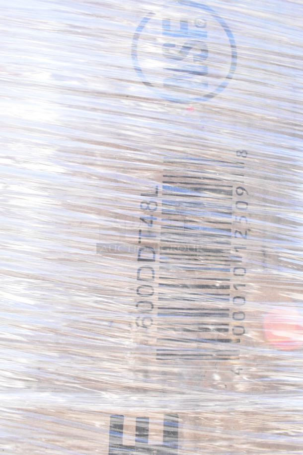 Bundled items wrapped in plastic, including ingredient bin and dish table, labeled "600DDT-48L." Brand new, scratch and dent condition.