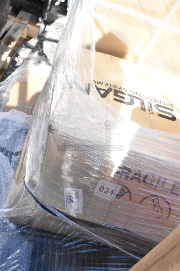 Plastic-wrapped pallet with "SILGAN Dispensing Systems" box and fragile label visible.