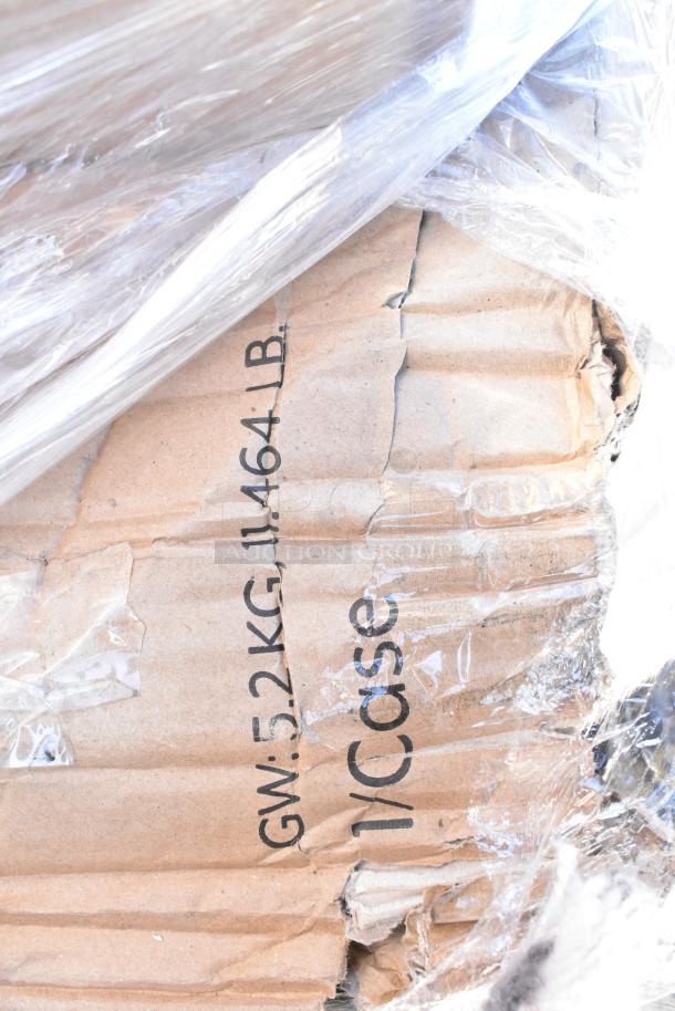 Cardboard box wrapped in plastic, marked "GW: 5.2 KG, 11.464 LB, 1/Case." Box shows minor dents, part of auction lot.