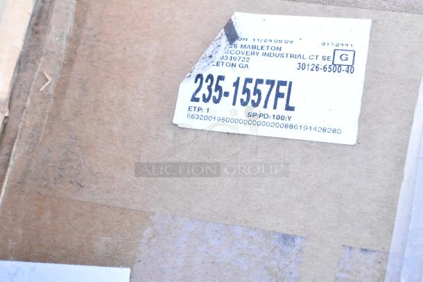 Brown cardboard box with a white label showing product code 235-1557FL and location details.
