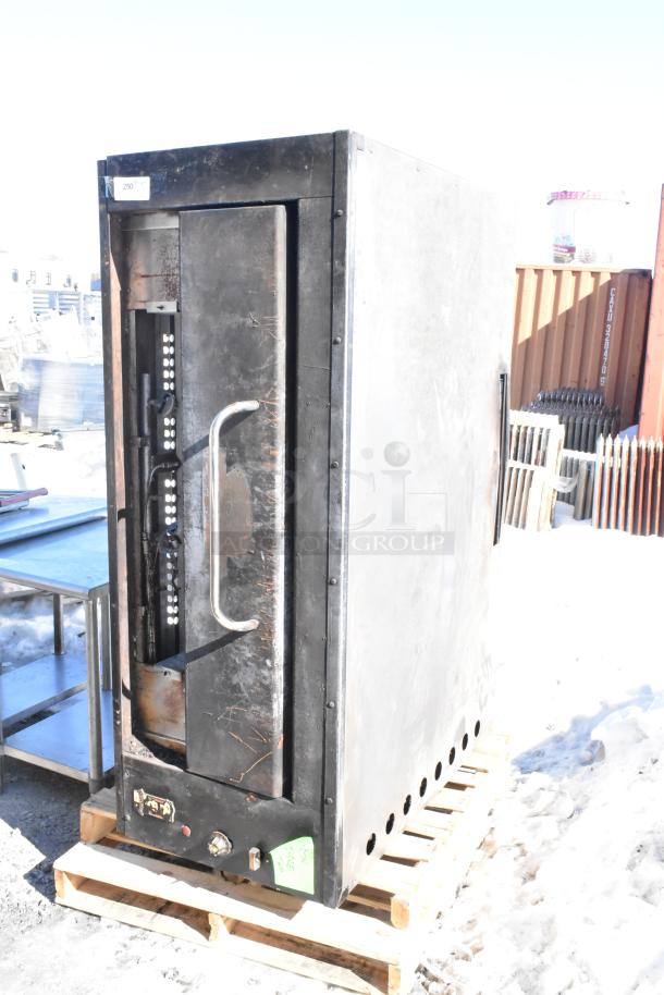 Montague Commercial Natural Gas Single Deck Pizza Oven; black finish, used condition, located on wooden pallet, visible dials.