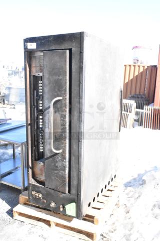 Montague Commercial Natural Gas Single Deck Pizza Oven; black finish, used condition, located on wooden pallet, visible dials.