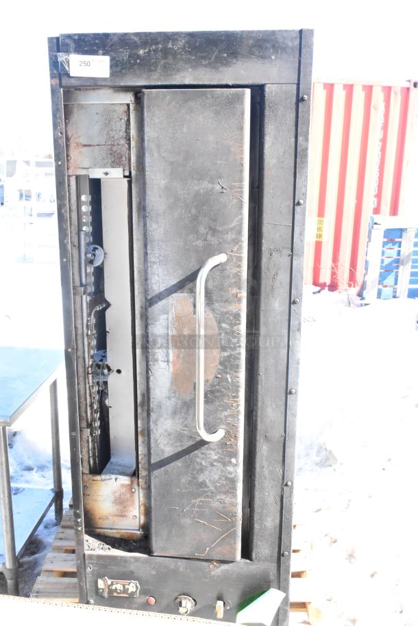Montague Commercial Natural Gas Single Deck Pizza Oven, used, visible wear on exterior, metal handle, label marked "250".