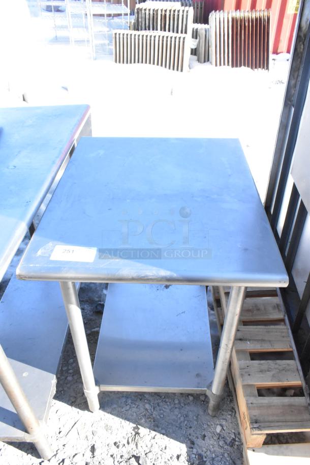 Stainless steel commercial table with under shelf, square top, moderate wear, labeled "251," suited for industrial use.
