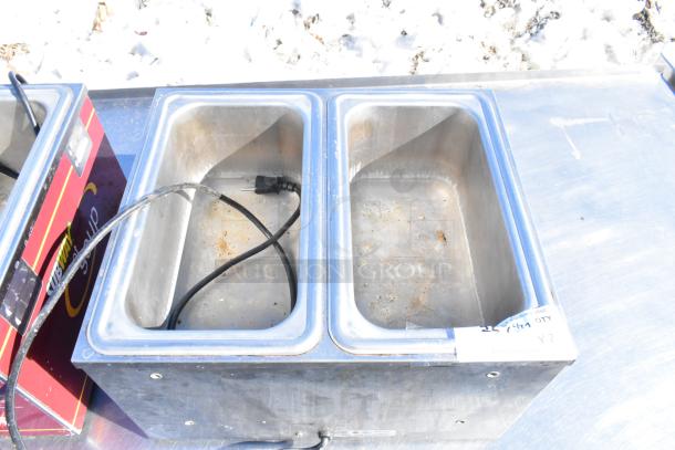 2 Nemco 6130-SUB commercial countertop food warmers, dual wells, 120 volts, used, with visible wear and attached labels.