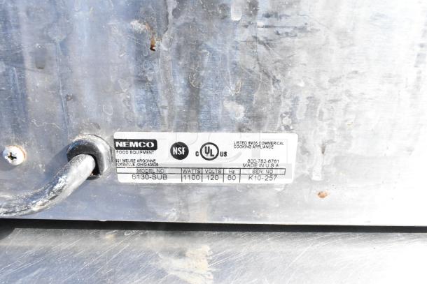 Nemco 6130-SUB food warmer label showing 120V, 1100W, model 6130-SUB, and serial K10-257.