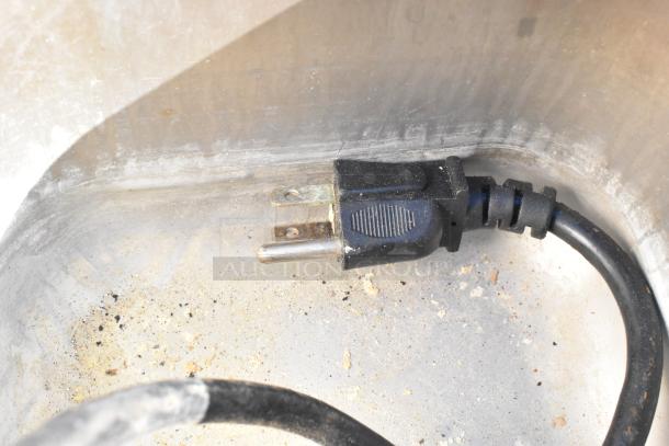 Plug inside Nemco 6130-SUB food warmer showing wear and residue, indicating use. 120 volts, 1 phase.