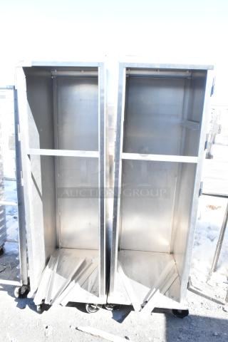 Two commercial pan transport racks on heavy-duty casters, open design, metal construction, used condition.