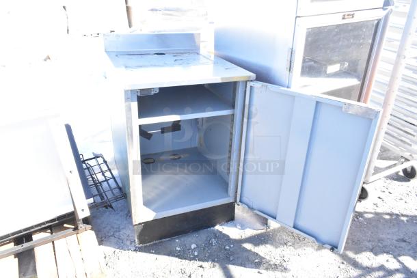 Duke SUBP-24M counter with wood pattern door, open showing interior shelves, metal exterior, used condition.