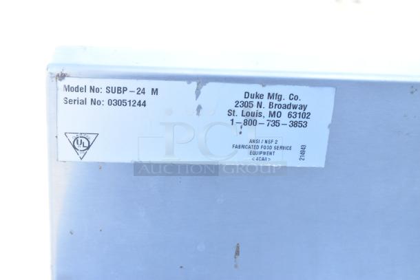 Label on Duke SUBP-24M Counter showing model, serial number 03051244, and manufacturer details.