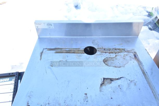 Duke SUBP-24M Counter with wood pattern door, visible wear, metal surface, label indicates model and specs.