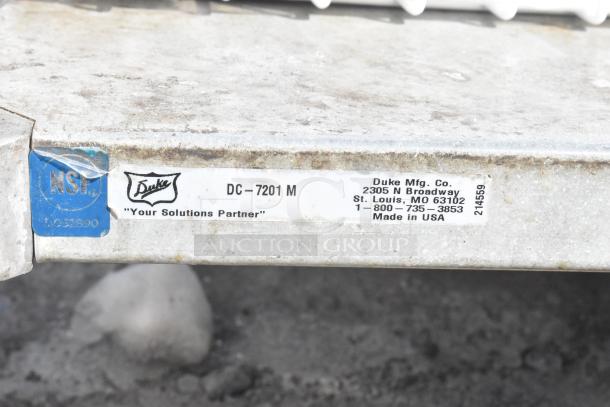 Commercial table by Duke Mfg. Co., model DC-7201 M, with metal under shelf. NSF certified, made in USA.