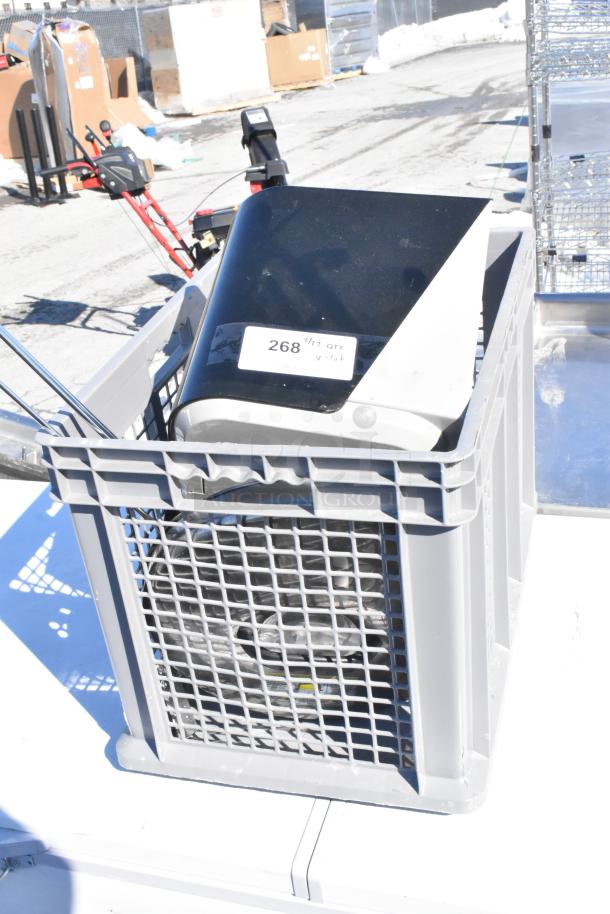 Lot of various items in a gray plastic bin, includes a black and white device with a label marked "268," condition appears used.