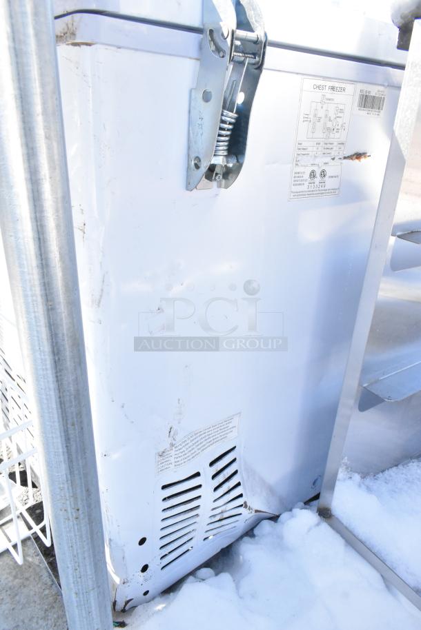 Coldline BD-600 Chest Freezer, 115 volts, 1 phase. Visible wear on white exterior; label indicates model and specs.
