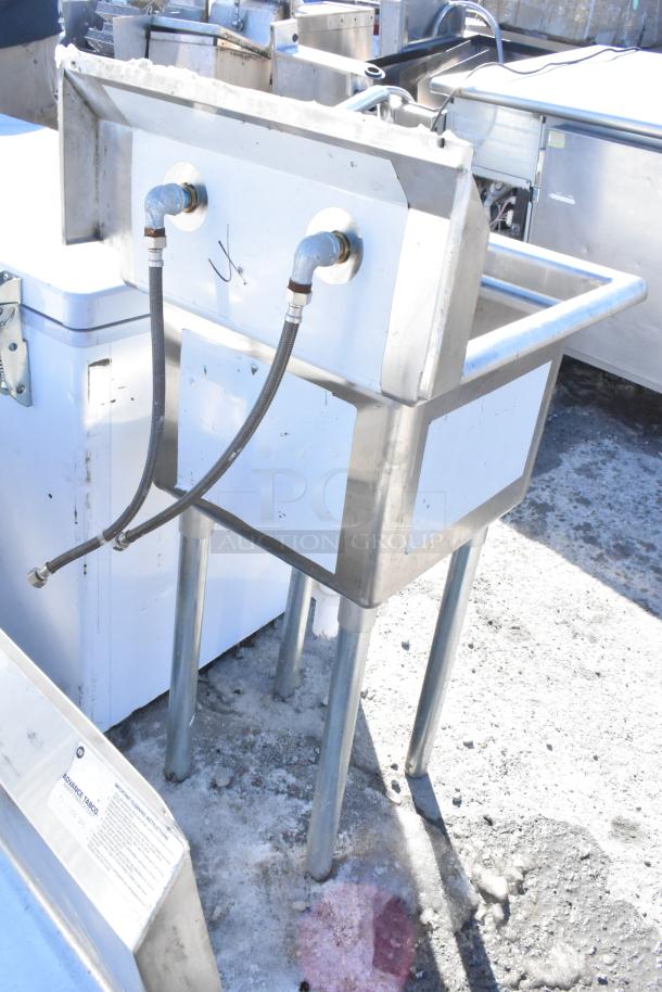 Commercial single bay sink with faucet and handles, stainless steel, used condition, includes visible plumbing connections.