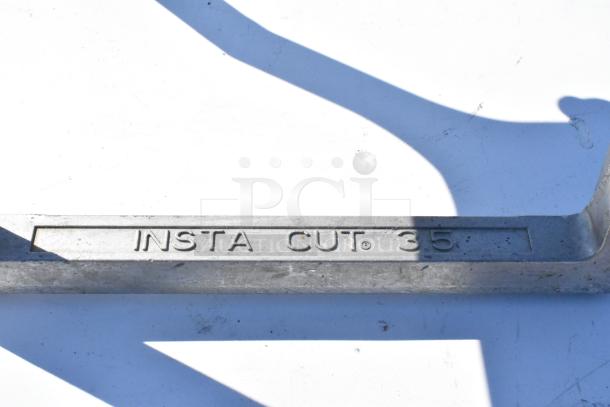 Insta Cut 35 metal countertop vegetable dicer, features sturdy construction, visible "INSTA CUT 35" marking, good condition.