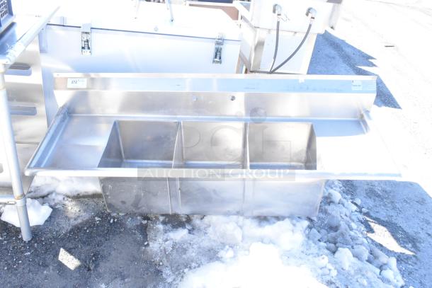 Advance Tabco Commercial 3 Bay Sink with dual drain boards, missing legs. Made of stainless steel, suitable for heavy-duty use.