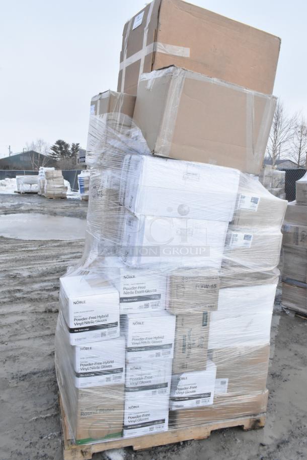 Pallet of assorted scratch and dent items in boxes, including paper towels, gloves, and straws, wrapped in plastic.