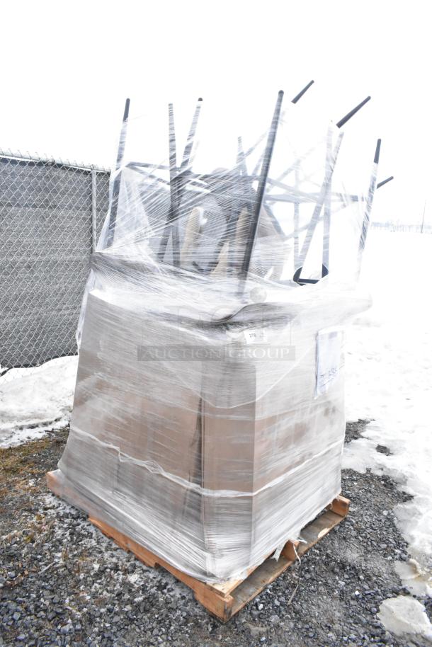 Pallet of 12 new scratch and dent items, including chairs, wrapped in plastic, visible labels with lot number 219.