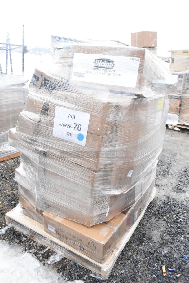 Pallet with 36 new scratch and dent items; includes metal pans, spatulas, towel dispensers, and shovel. Boxes labeled "Heinz."