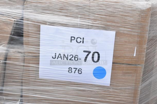 Pallet wrapped in plastic showing label with "PCI JAN26-70 876" and a blue dot, boxed auction items inside.