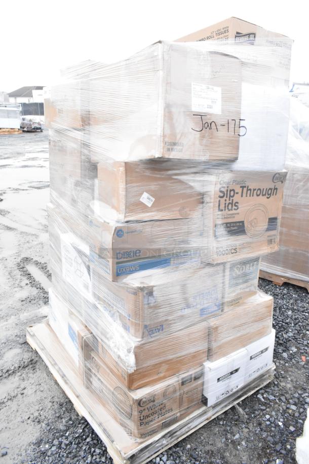 Pallet of mixed scratch and dent items wrapped in plastic, including branded boxes for gloves, towels, and bags, labeled "Jan-175."